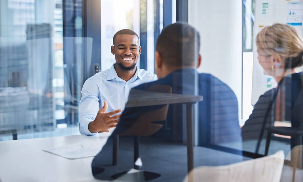 Business people talking in interview with employee